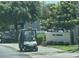 View of a golf cart on the streets near the 'The Greens' sales office, promoting a resort lifestyle at 430 Ocean Creek Dr. # 2534, Myrtle Beach, SC 29572