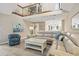 Sunlit living area with soaring ceilings and an open floor plan highlights a comfortable and stylish living space at 430 Ocean Creek Dr. # 2534, Myrtle Beach, SC 29572