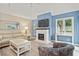 Comfortable living room with a fireplace and vaulted ceilings at 430 Ocean Creek Dr. # 2534, Myrtle Beach, SC 29572