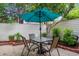 Patio features a table, umbrella, and seating perfect for outdoor entertaining at 430 Ocean Creek Dr. # 2534, Myrtle Beach, SC 29572