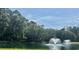 Scenic pond with fountains and lush greenery, creating a peaceful and picturesque environment at 430 Ocean Creek Dr. # 2534, Myrtle Beach, SC 29572