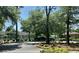 Scenic view of the tennis courts surrounded by lush greenery and manicured landscaping at 430 Ocean Creek Dr. # 2534, Myrtle Beach, SC 29572