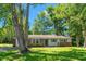 Charming one-story home featuring a brick and white facade with blue shutters and a well-maintained lawn at 4300 Crows Nest Ct., Myrtle Beach, SC 29579