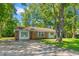 The exterior view displays an angle of the house showcasing its brick accents, siding, and the property's well-kept lawn at 4300 Crows Nest Ct., Myrtle Beach, SC 29579