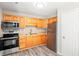 Updated kitchen with wood cabinets, stainless appliances, and subway tile at 4300 Crows Nest Ct., Myrtle Beach, SC 29579