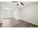 Bright living room features stylish wood floors, a ceiling fan, and ample closet space at 4300 Crows Nest Ct., Myrtle Beach, SC 29579