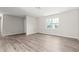 This spacious living room features wood-look flooring, a large window and ample electrical outlets at 4300 Crows Nest Ct., Myrtle Beach, SC 29579