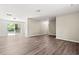 The inviting living room features sliding glass doors to the backyard and wood-look flooring at 4300 Crows Nest Ct., Myrtle Beach, SC 29579