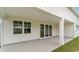 Covered patio with concrete floor, providing a shaded outdoor space, accessible through sliding glass doors at 438 Clear Lake Dr., Conway, SC 29526