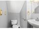 Powder room features a toilet, sink, and vintage gold-tone fixtures at 4406 Barcelona Ln., Little River, SC 29566