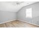Bright bedroom with laminate wood flooring, neutral walls, and a large window at 4406 Barcelona Ln., Little River, SC 29566