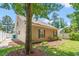Exterior view of home featuring a small manicured lawn and neutral siding at 4406 Barcelona Ln., Little River, SC 29566