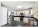 Bright kitchen with stainless steel refrigerator, modern appliances, and a gray countertop island at 4406 Barcelona Ln., Little River, SC 29566