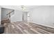 Bright living room with hardwood floors, staircase, and ample natural light at 4406 Barcelona Ln., Little River, SC 29566