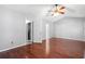 Primary bedroom with laminate floors and doorways to laundry room and other rooms at 4406 Barcelona Ln., Little River, SC 29566