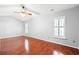 Bright primary bedroom with vaulted ceiling, laminated floors, and shuttered windows at 4406 Barcelona Ln., Little River, SC 29566