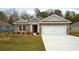 Charming single-story home featuring stone accents and a well-maintained front yard at 444 Clear Lake Dr., Conway, SC 29526