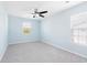 A bright, airy bedroom with a ceiling fan, neutral carpet, and two windows at 4603 East Walkerton Rd., Myrtle Beach, SC 29579