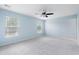 Spacious bedroom with light blue walls, carpet, fan, and natural light at 4603 East Walkerton Rd., Myrtle Beach, SC 29579