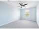 A bright, airy bedroom with a ceiling fan, neutral carpet, and a window at 4603 East Walkerton Rd., Myrtle Beach, SC 29579