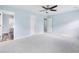 Spacious bedroom with light blue walls, multiple doors, and carpet flooring at 4603 East Walkerton Rd., Myrtle Beach, SC 29579