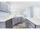 Modern kitchen featuring gray cabinets, white countertops, stainless steel appliances, and a gray laminate floor at 4603 East Walkerton Rd., Myrtle Beach, SC 29579