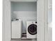 Convenient laundry area features updated, modern washer and dryer units and built-in shelving at 4603 East Walkerton Rd., Myrtle Beach, SC 29579