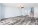 Living room with modern flooring, a ceiling fan, and a staircase at 4603 East Walkerton Rd., Myrtle Beach, SC 29579