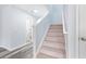 Carpeted staircase leading to the upper level of the home at 4603 East Walkerton Rd., Myrtle Beach, SC 29579