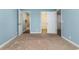 A serene bedroom features calming blue walls and neutral carpeting at 4633 Lightkeepers Way # 5-F, Little River, SC 29566