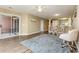 Bright living room with wood floors, a sliding glass door to a patio, and an adjacent dining area at 4633 Lightkeepers Way # 5-F, Little River, SC 29566