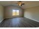 Bedroom with vaulted ceilings, ceiling fan, and large window at 475 Highway 348, Loris, SC 29569
