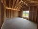 An unfinished bonus room with a window and wooden framing at 475 Highway 348, Loris, SC 29569