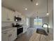 Modern kitchen features white cabinets, stainless steel appliances and marble countertops at 475 Highway 348, Loris, SC 29569