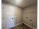 Clean laundry room with white shelving, wood-look floors, and hookups for appliances. Ready for your personal touch! at 475 Highway 348, Loris, SC 29569