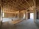 Unfinished living room shows the wooden framework, framing and flooring prior to drywall being installed at 475 Highway 348, Loris, SC 29569