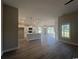 Open-concept living space featuring hardwood floors, a kitchen island, and an abundance of natural light at 475 Highway 348, Loris, SC 29569