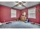 Bedroom features red painted walls and ceiling with decorative border at 4810 Circle Dr., Loris, SC 29569