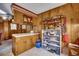 Spacious kitchen featuring wood cabinets, open shelving, ample counter space, and a vintage trash bin at 4810 Circle Dr., Loris, SC 29569