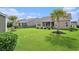 Spacious backyard featuring a lush lawn and mature trees at 505 Joy Way Ct., Longs, SC 29568
