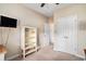 This bedroom has carpeted floors, white trim, and a white bookshelf, perfect for flexible use at 505 Joy Way Ct., Longs, SC 29568