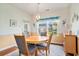 Charming dining room with a round wooden table, comfortable chairs, and natural light at 505 Joy Way Ct., Longs, SC 29568