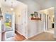 Inviting foyer with a charming rug, stylish decor, and an open doorway to the outdoors at 505 Joy Way Ct., Longs, SC 29568