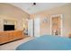 The main bedroom shows a dresser with TV, double closet, and access to a bathroom at 505 Joy Way Ct., Longs, SC 29568