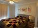 Comfortable bedroom featuring a large window and colorful patchwork quilt on the bed at 550 Bridgeport Dr., Myrtle Beach, SC 29577