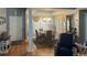 Bright dining room featuring hardwood floors, elegant chandelier, and ample natural light at 550 Bridgeport Dr., Myrtle Beach, SC 29577