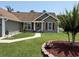 Charming single-story home boasts manicured landscaping, a cozy porch, and a welcoming walkway at 550 Bridgeport Dr., Myrtle Beach, SC 29577