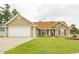 Charming single-story home with well-maintained lawn, attached garage, and mature landscaping at 550 Bridgeport Dr., Myrtle Beach, SC 29577