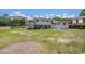 Spacious backyard featuring a covered patio, perfect for outdoor entertaining and relaxation at 5612 N Kings Hwy., Myrtle Beach, SC 29577