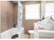Updated bathroom featuring a tub and shower combination with modern fixtures and tiled walls at 5612 N Kings Hwy., Myrtle Beach, SC 29577
